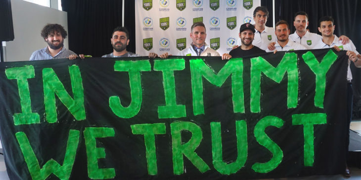 Lucas Piatti (second from left) joins fellow Generation IX supporters after Jim Brennan was revealed as coach of York 9 FC. (Armen Bedakian)
